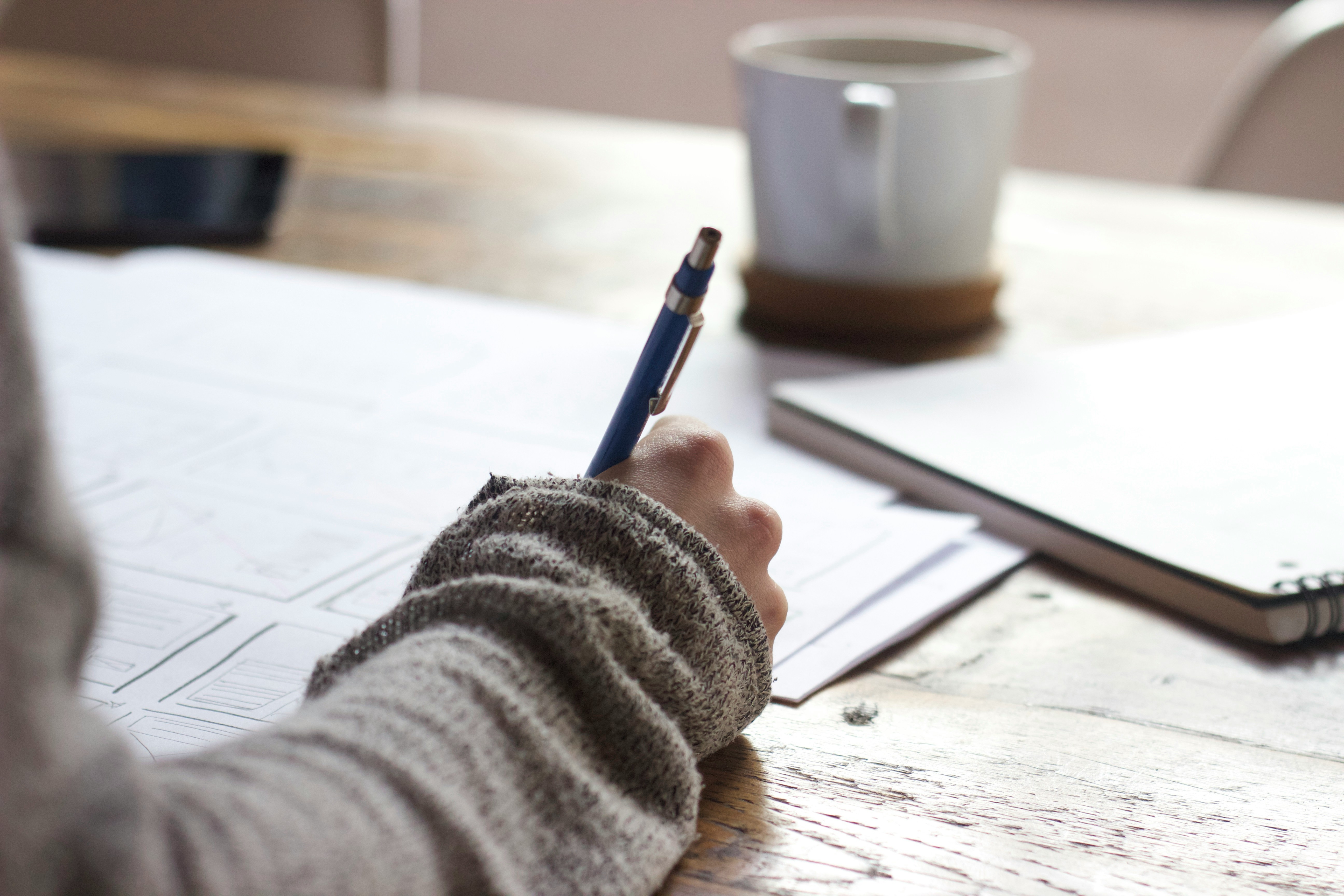 person writing on a worksheet